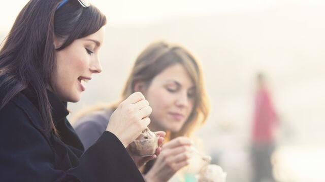 two women eating ice cream 