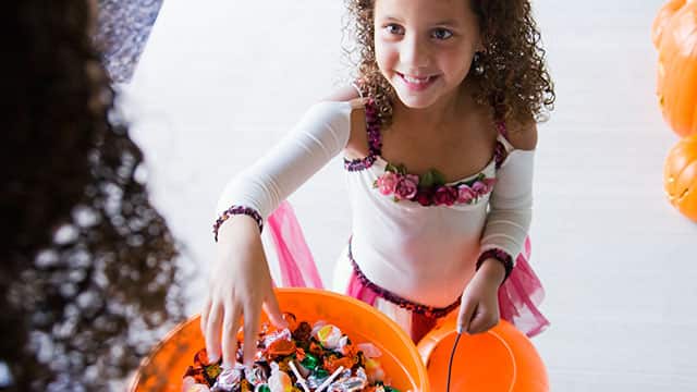 A girl and mom with the Halloween candy