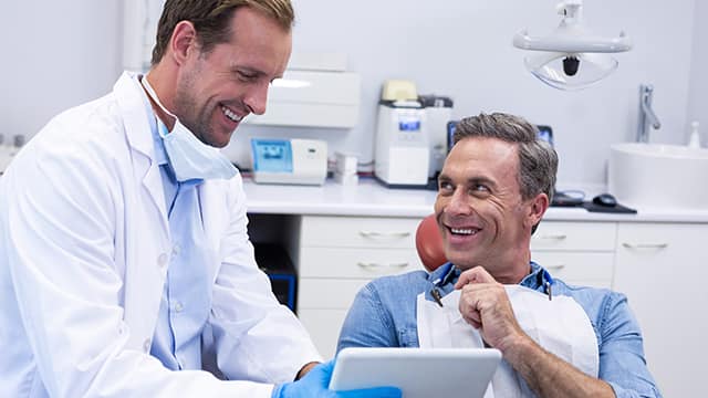Dentist talking to patient about needs