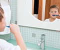 Young boy brushing his teeth