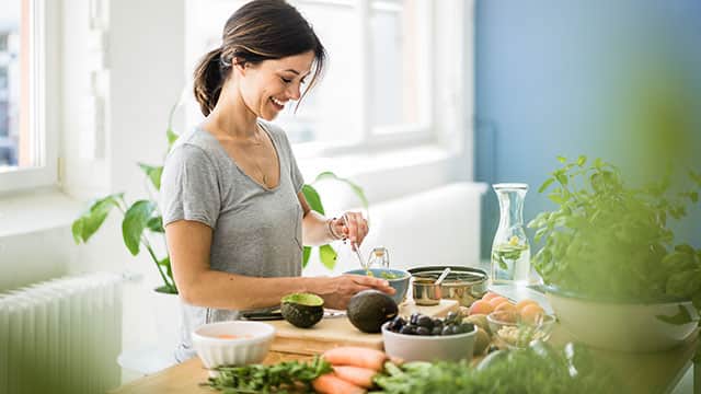 A woman is preparing a healthy food