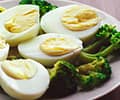 A plate of hard boiled eggs an broccoli 