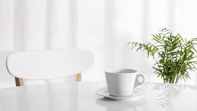 White cup on kitchen table
