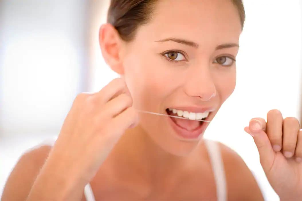 woman flossing properly