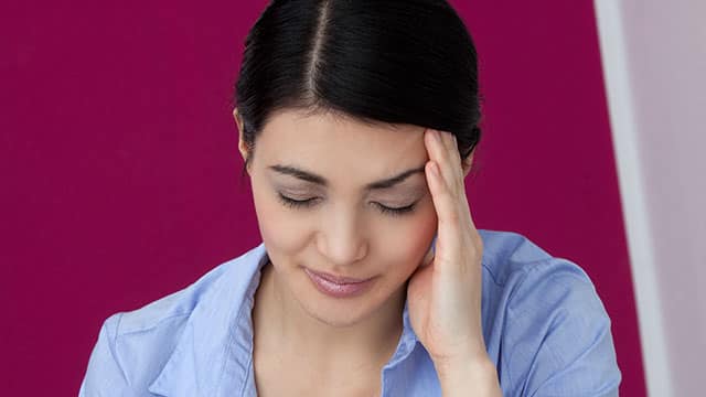 A woman having a headache