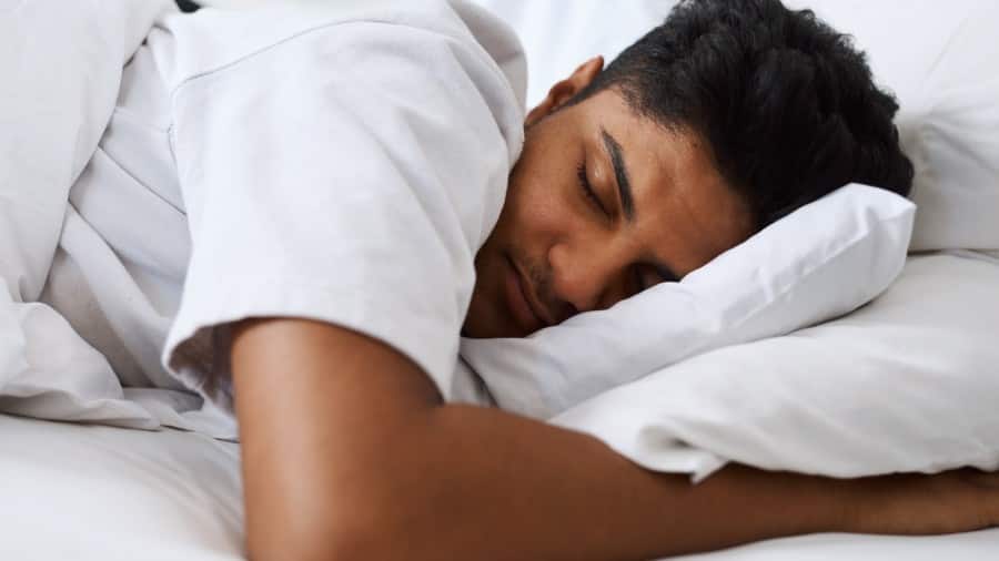 Man sleeping, illustrating teeth grinding during sleep