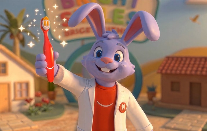 Dr. Rabbit holding a glowing toothbrush in the Colgate BSBF Brushing Challenge video