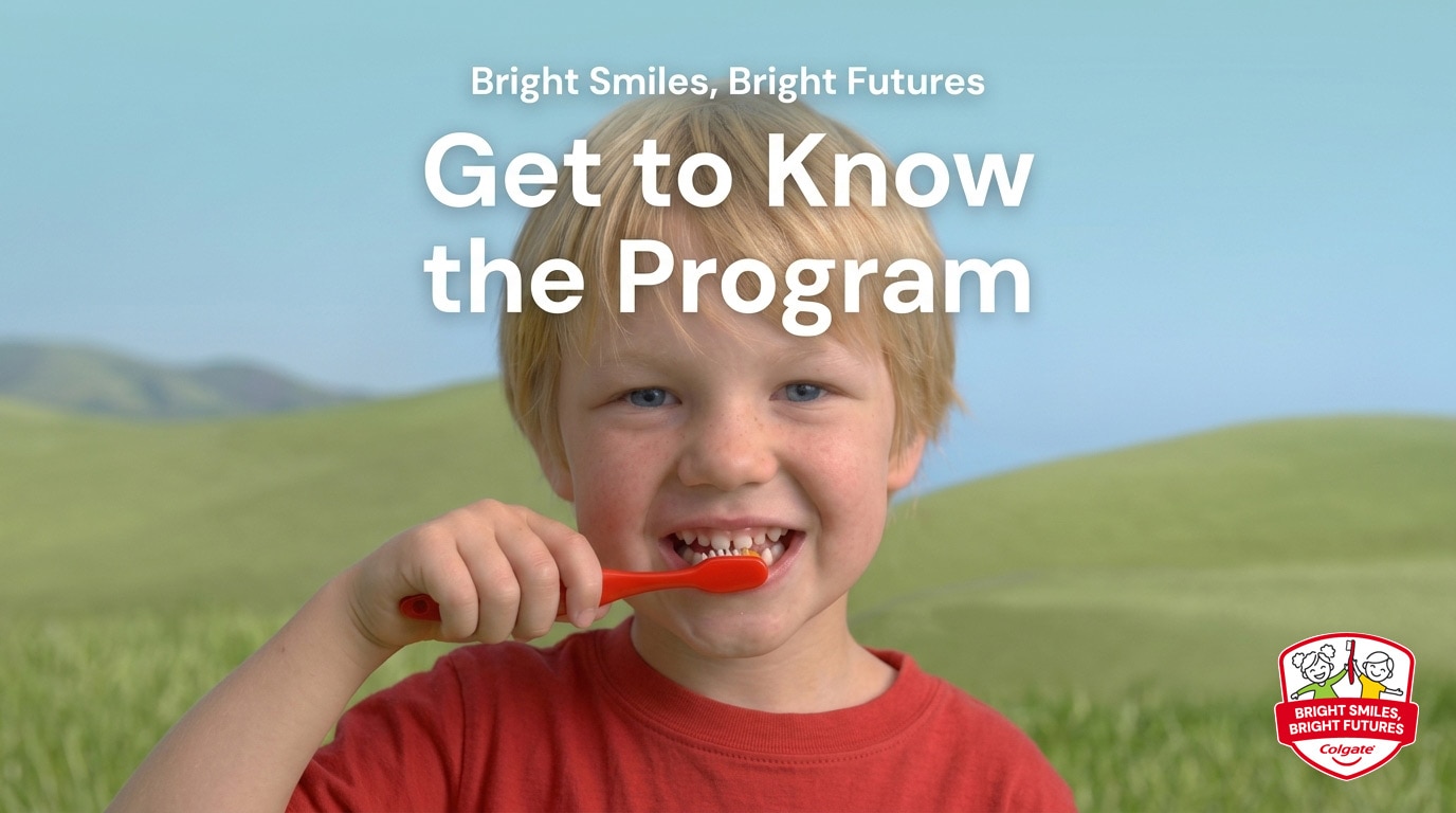 Young blonde boy brushing teeth with a red toothbrush for Bright Smiles Bright Futures oral care program