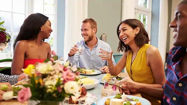 a group of friends having lunch together indoors