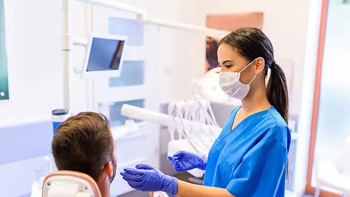 dentist discussing swollen soft palate with patient