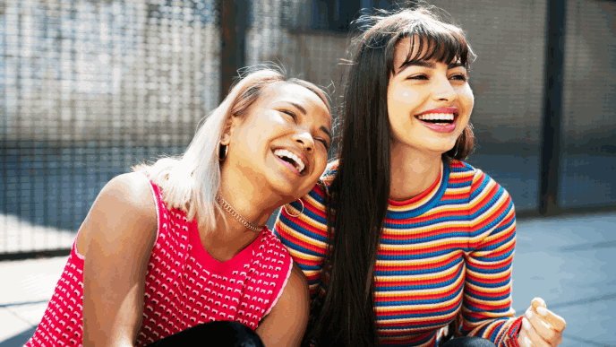 2 girlfriends hanging out smiling