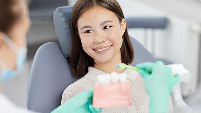 A girl looking at her dentist