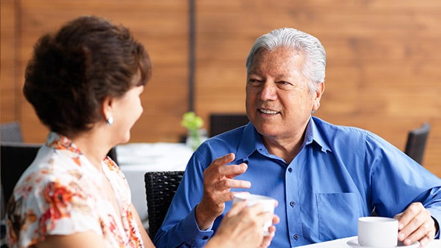 Senior couple talking in restaurant