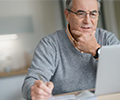 man looking at a computer