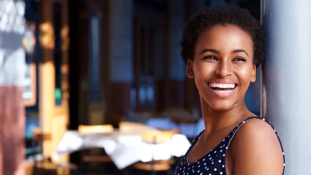 A young woman smiling