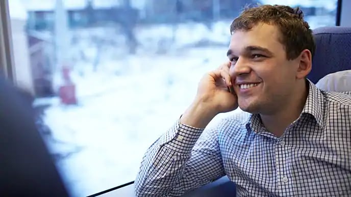 Man on phone with dentist discussing root canal procedure