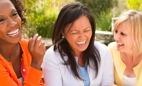 woman laughing with friends