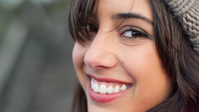 A girl smiling after fluoride mouth rinsing