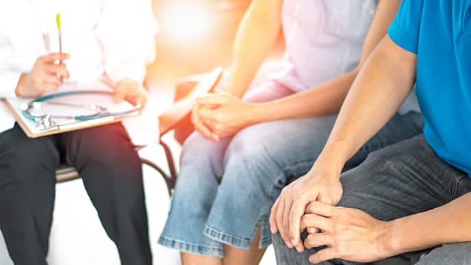 couple speaking with the doctor about hpv in men