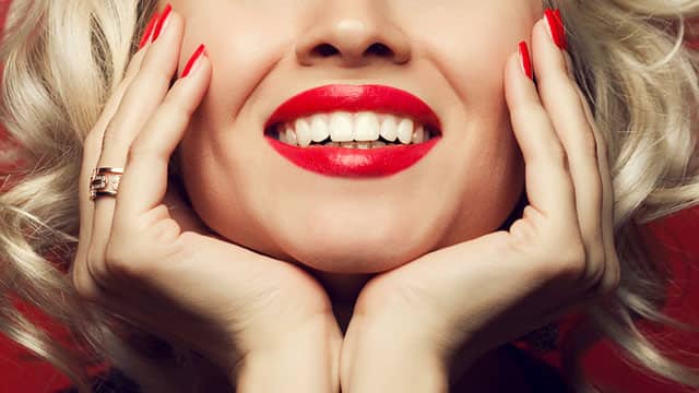 Young woman in makeup smiling