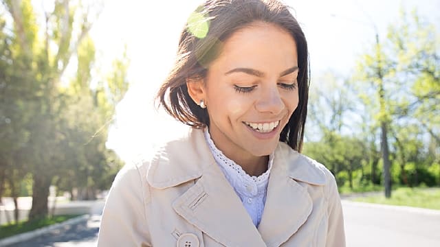 Smiling woman walking outdoors