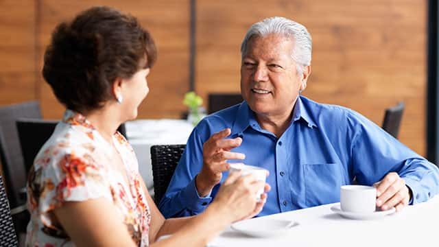 Middle age man is talking to the woman