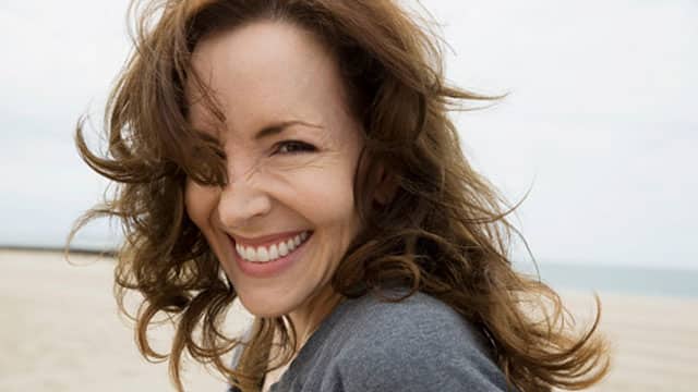 Woman smiling outside