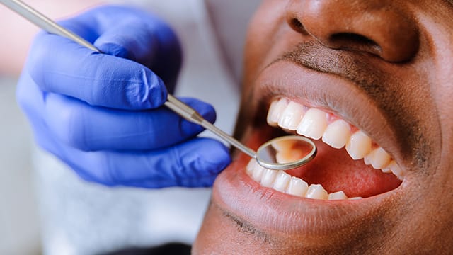 man getting teeth cleaned