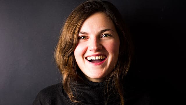 Close-up of brunette smiling with a tooth gap
