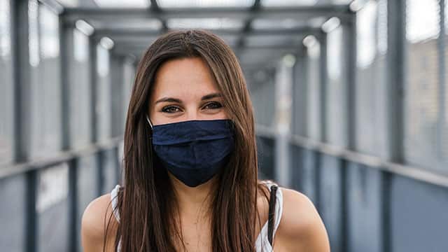 Woman wearing a mask outside