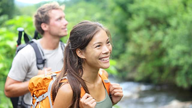 Young couple hiking in a forest