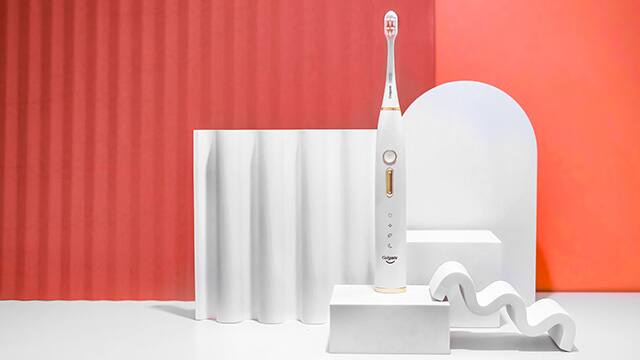 Electric Toothbrush on orange background