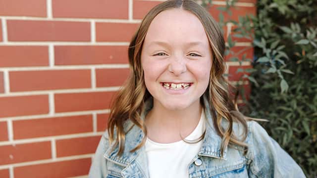Smiling teenage girl outside