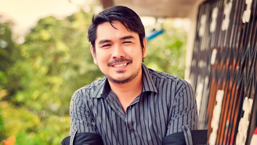 Man smiling outdoors