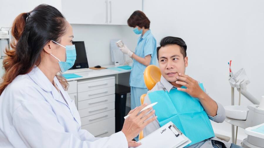 Man talking with his dentist