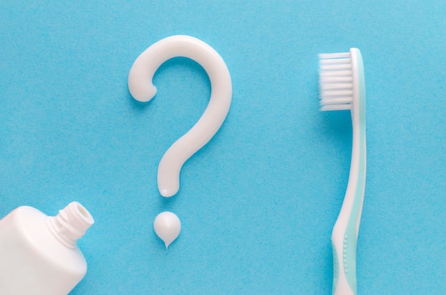 Toothpaste and toothbrush are placed to explain the best toothpaste for bleeding gums.