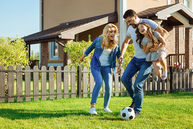 family playing soccer together