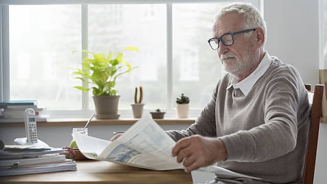 Senior Adult Readding Newspaper Leisure Concept
