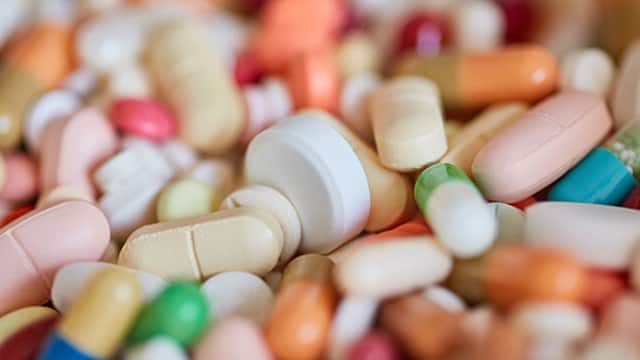 Many medications colorful pills medicine background