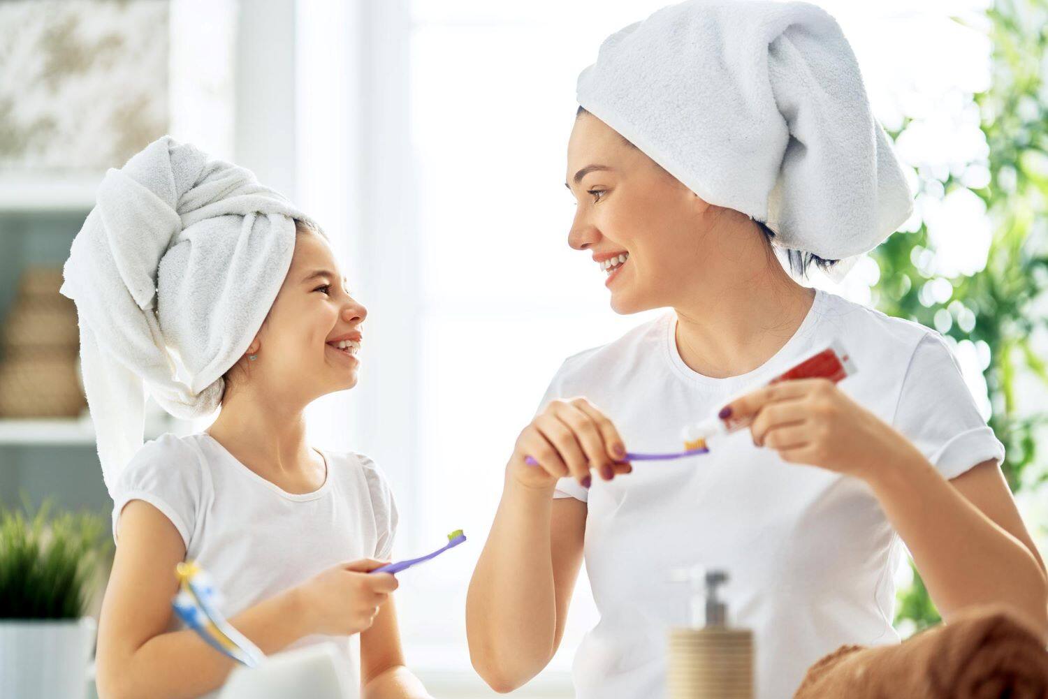 mom-and-daughter-brushing-teeth