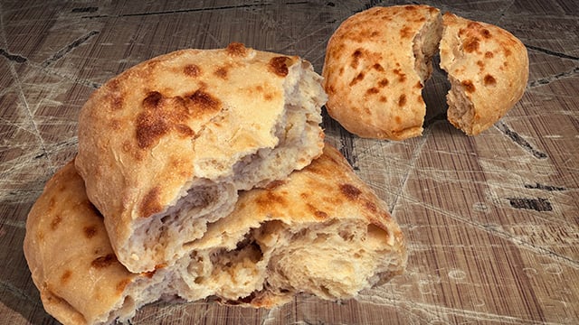 Two fresh aromatic fireplace baked leavened