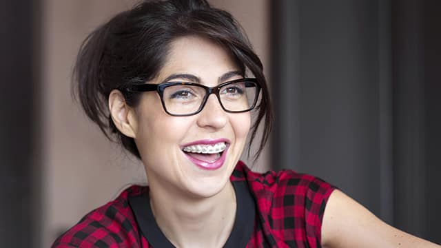 Portrait of a woman with braces on
