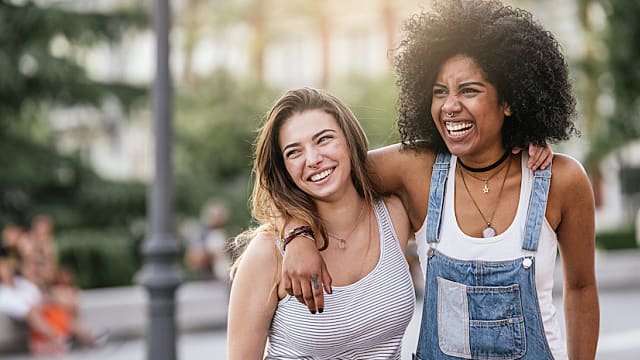 Beautiful women having fun in the street.