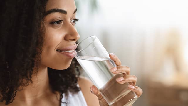 Woman drinking a glass of water
