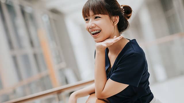 Young girl with braces smiling