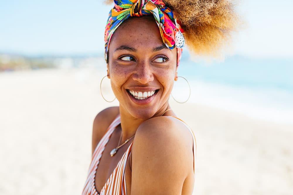 Smiling woman at the beach