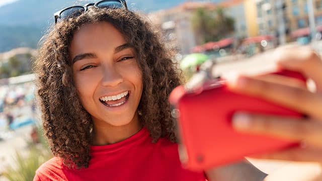 Teenage girl Taking a Selfie outdoors