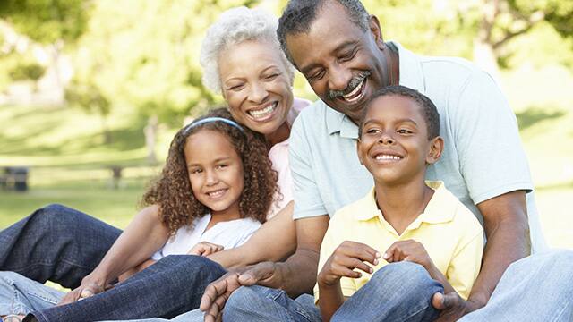 older couple playing with grandchildren