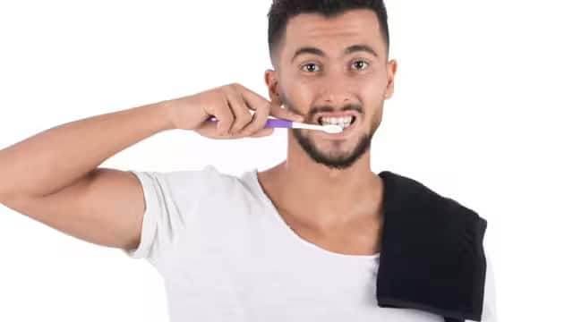 attractive-man-putting-towel-on-his-shoulder
