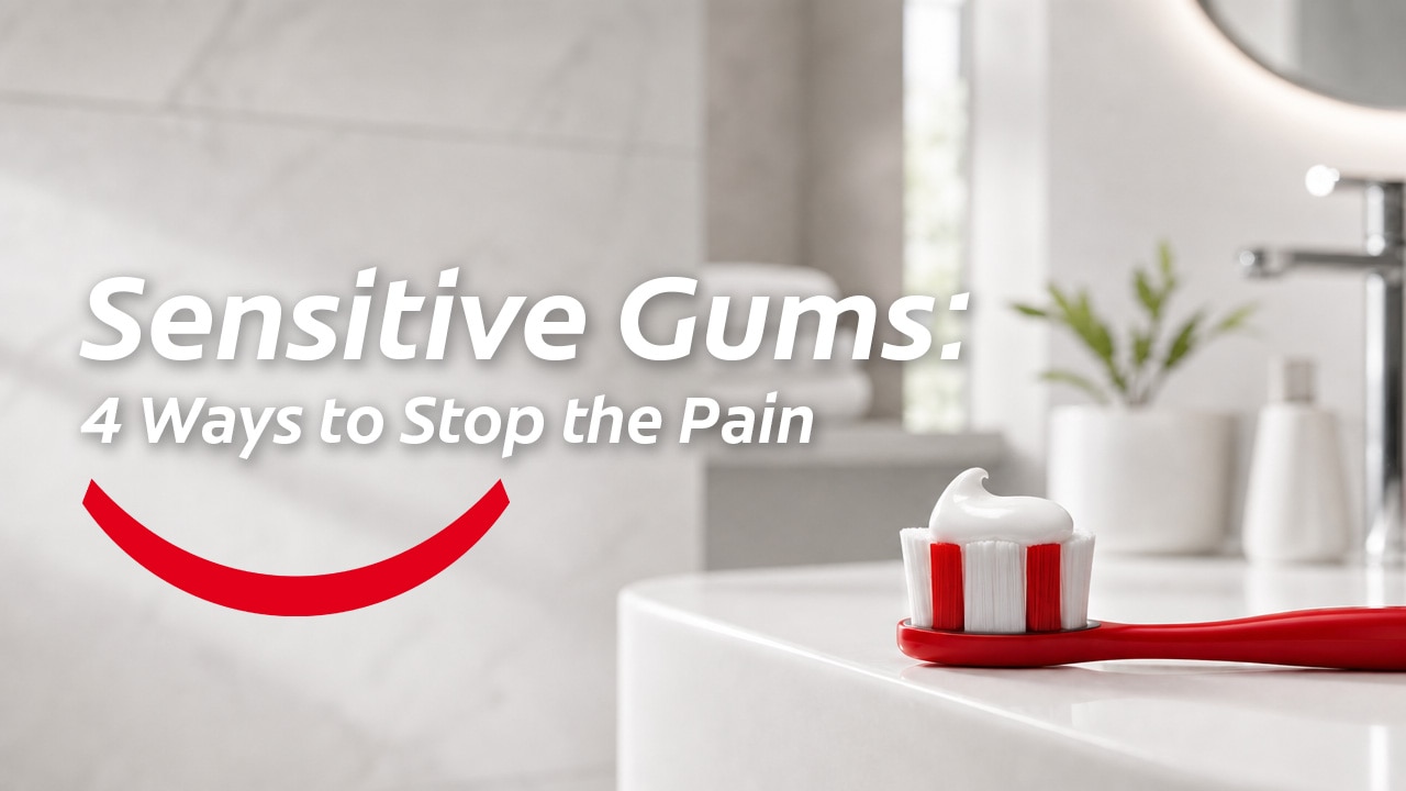 Red toothbrush with white toothpaste on a counter with text reading Sensitive Gums: 4 Ways to Stop the Pain.